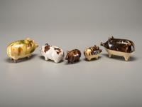 Fifteen Rockingham Glaze Mugs and Pig Banks