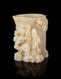 A Carved White Jade Brushpot Height 7 1/4 inches.