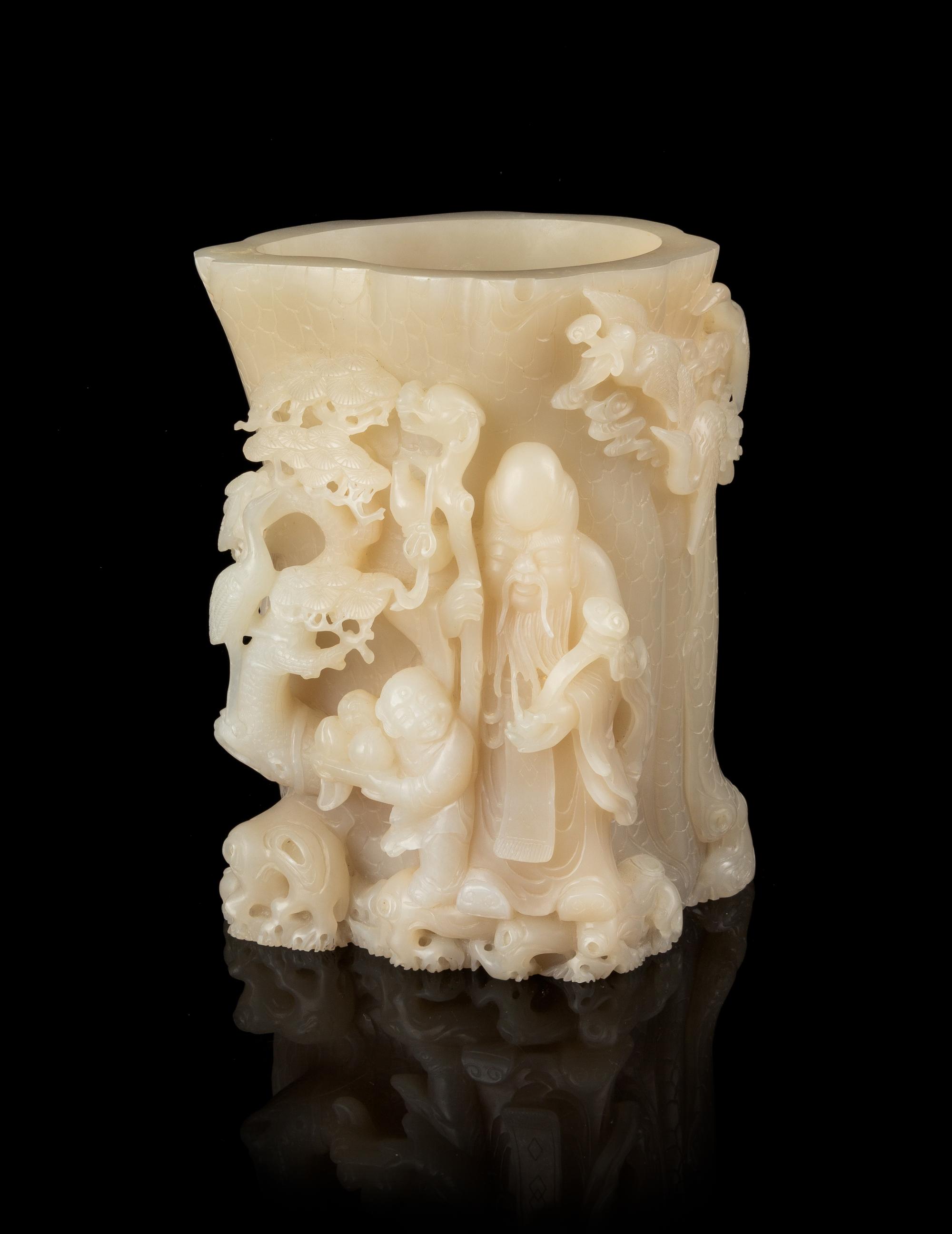 A Carved White Jade Brushpot Height 7 1/4 inches.