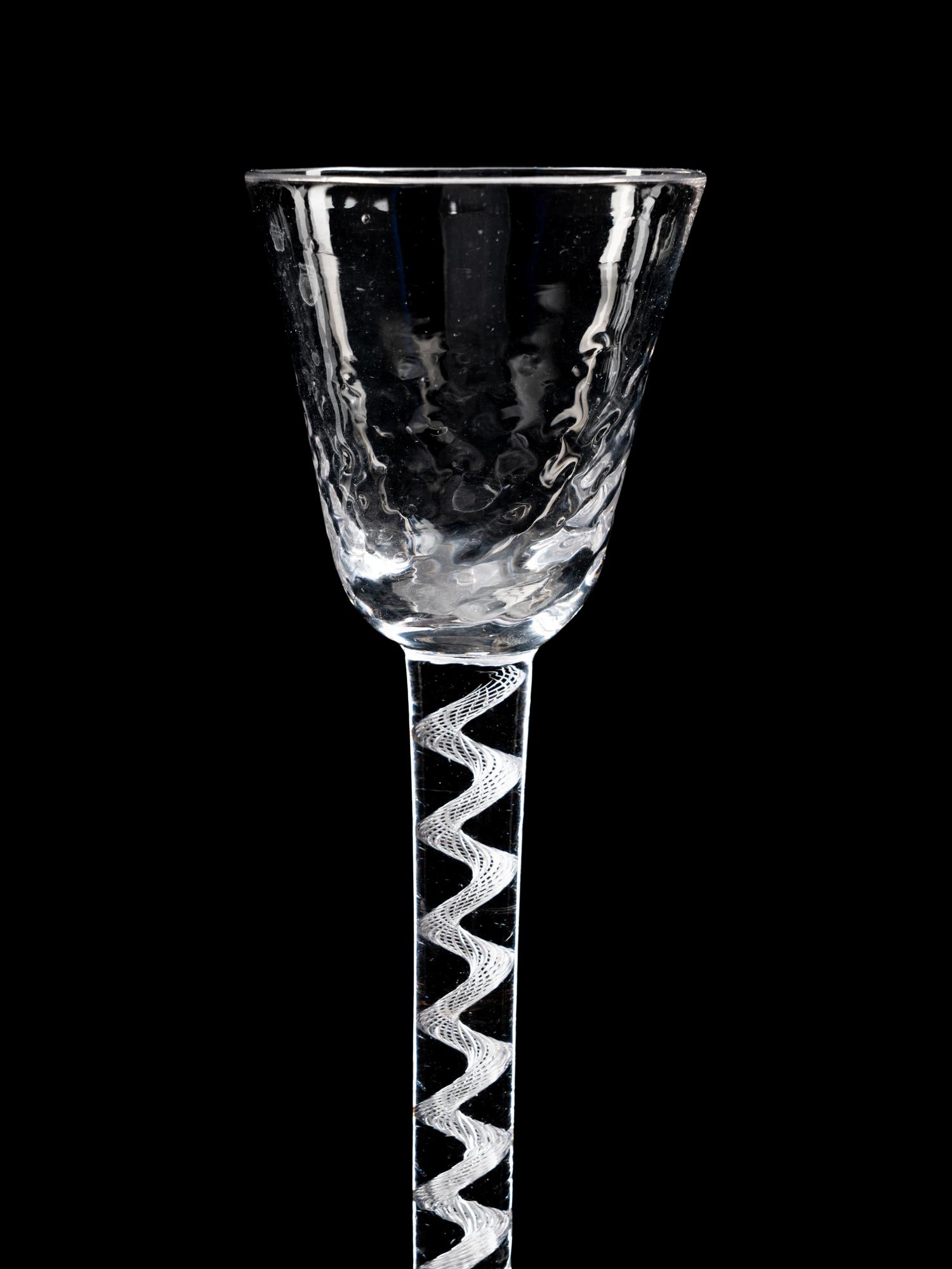 Two Moulded Glass Wine Glasses