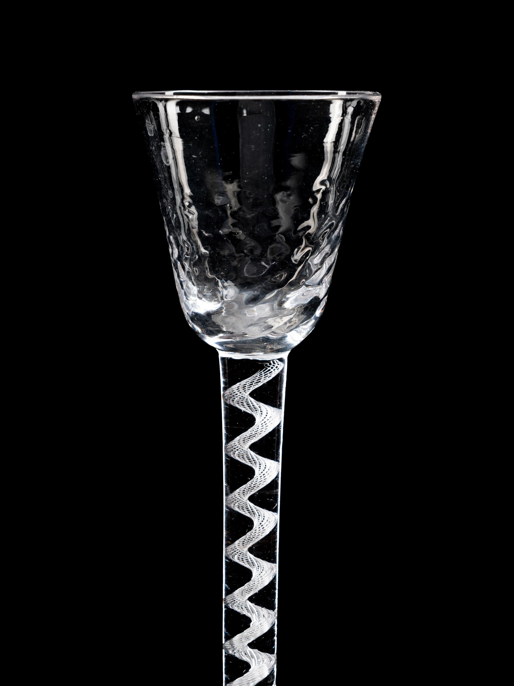 Two Moulded Glass Wine Glasses