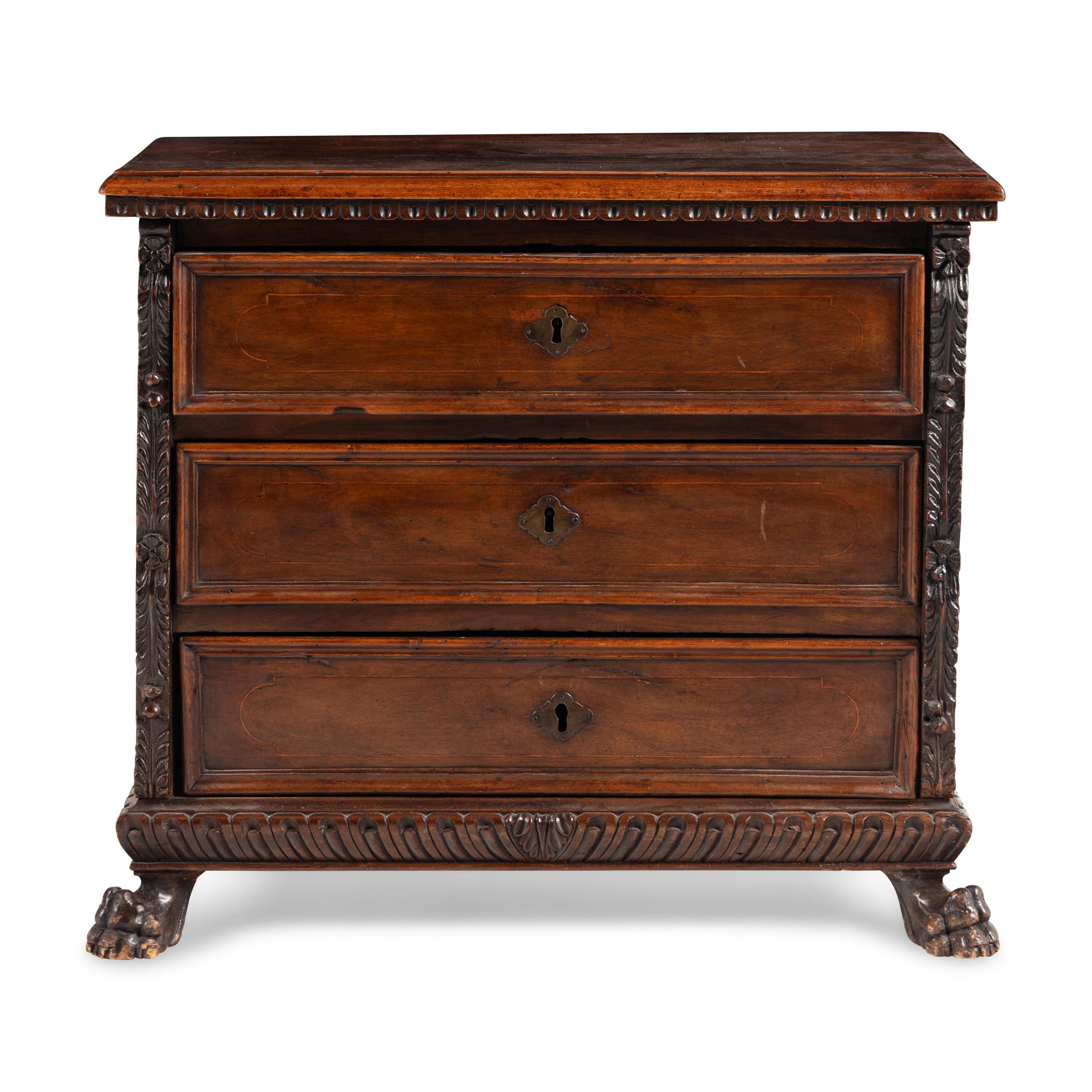 An Italian Baroque Walnut Chest of Drawers