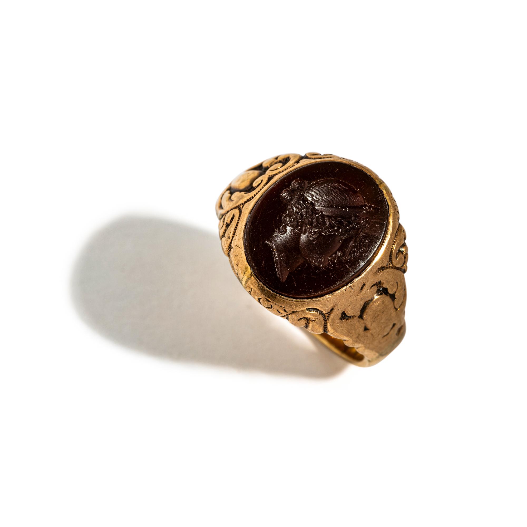 A Neoclassical Gold and Carnelian Finger Ring with the Portrait Head of a Woman