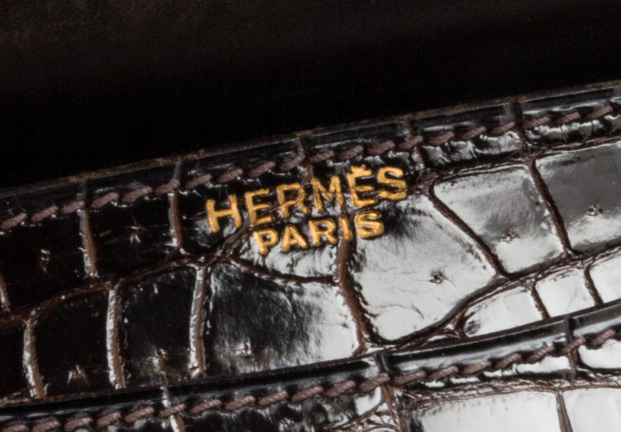 An Hermes Brown Crocodile Ring Handbag. 10" x 6.5" x 1.5".