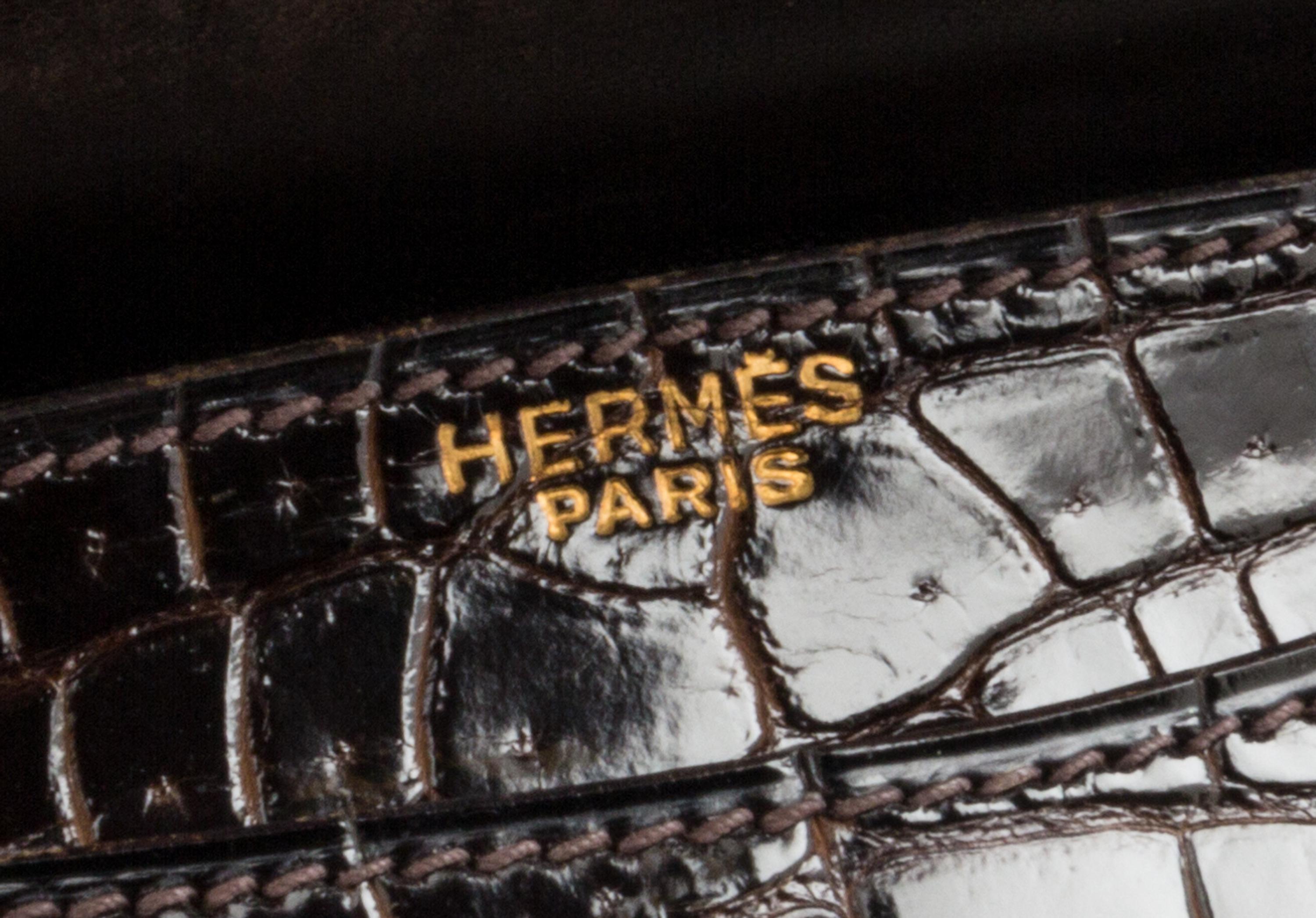 An Hermes Brown Crocodile Ring Handbag. 10" x 6.5" x 1.5".