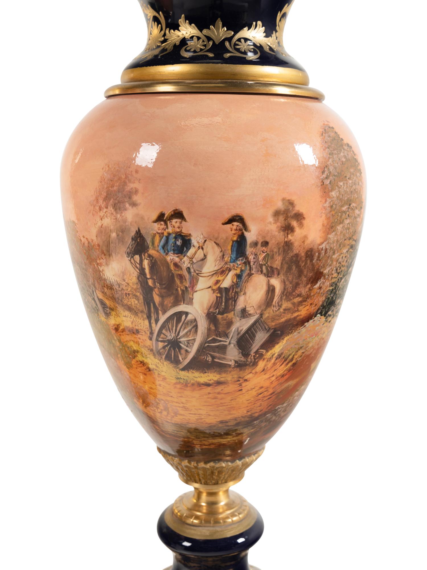 A Pair of Gilt Bronze Mounted Sèvres Style Porcelain Urns
