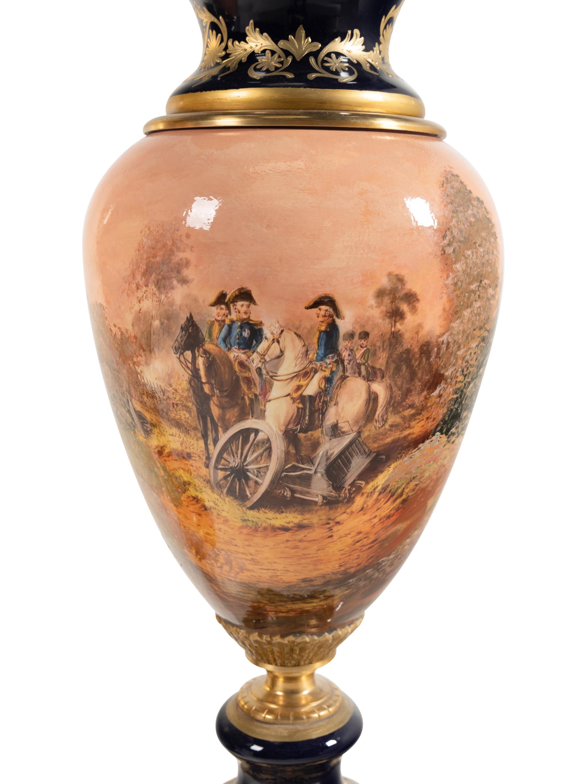 A Pair of Gilt Bronze Mounted Sèvres Style Porcelain Urns
