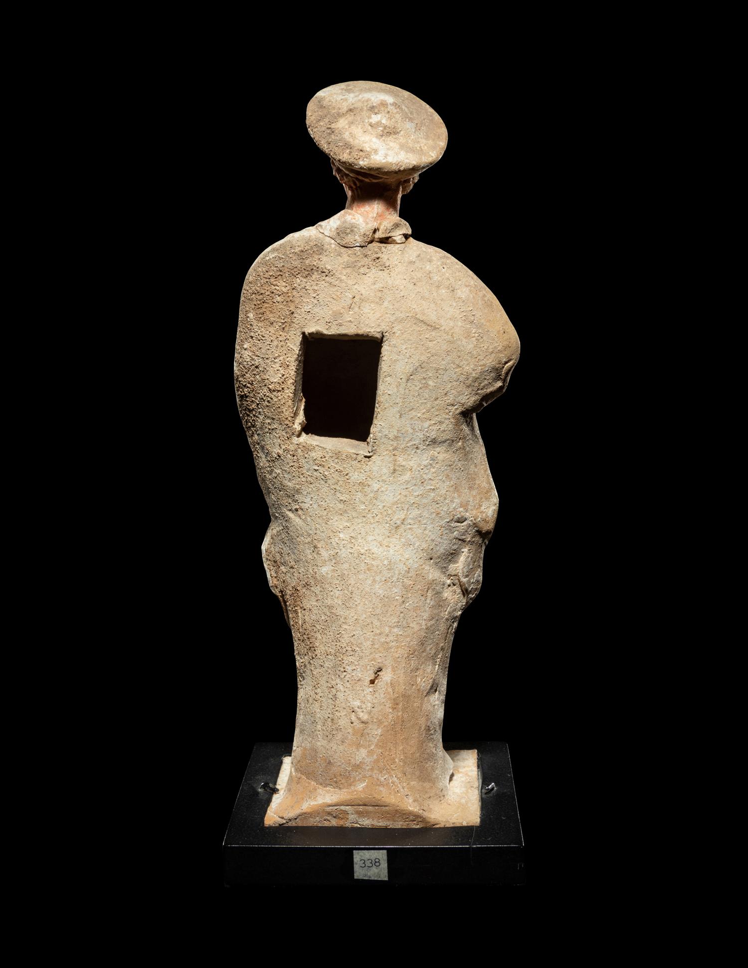 A Greek Painted Terra Cotta Male Figure