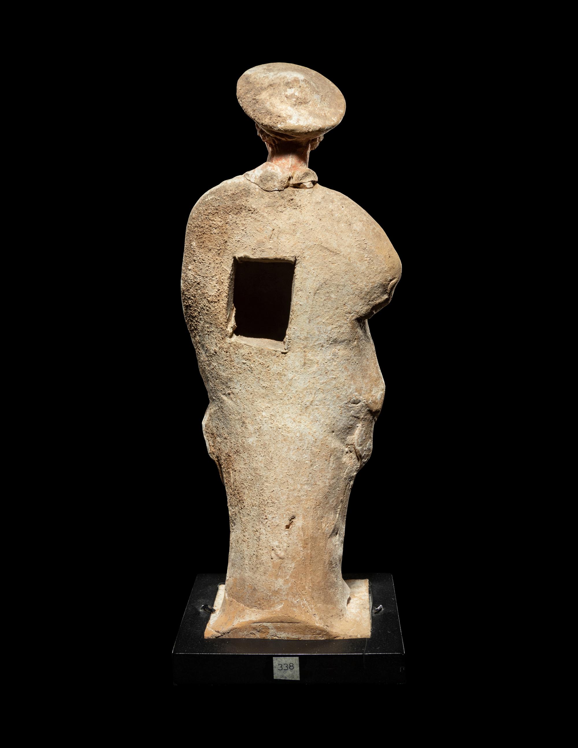 A Greek Painted Terra Cotta Male Figure