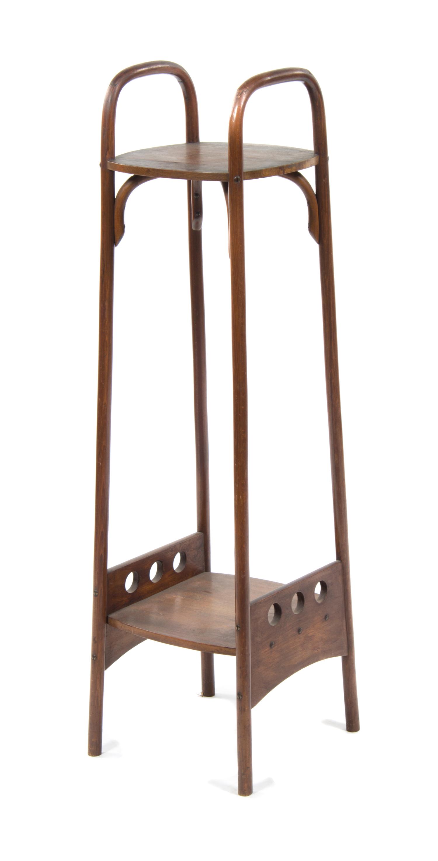 An Otto Prutscher Mahogany Etagere, for Thonet Height 48 1/8 x width 12 1/4 x depth 13 1/2 inches.