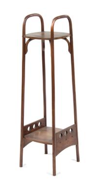 An Otto Prutscher Mahogany Etagere, for Thonet Height 48 1/8 x width 12 1/4 x depth 13 1/2 inches.