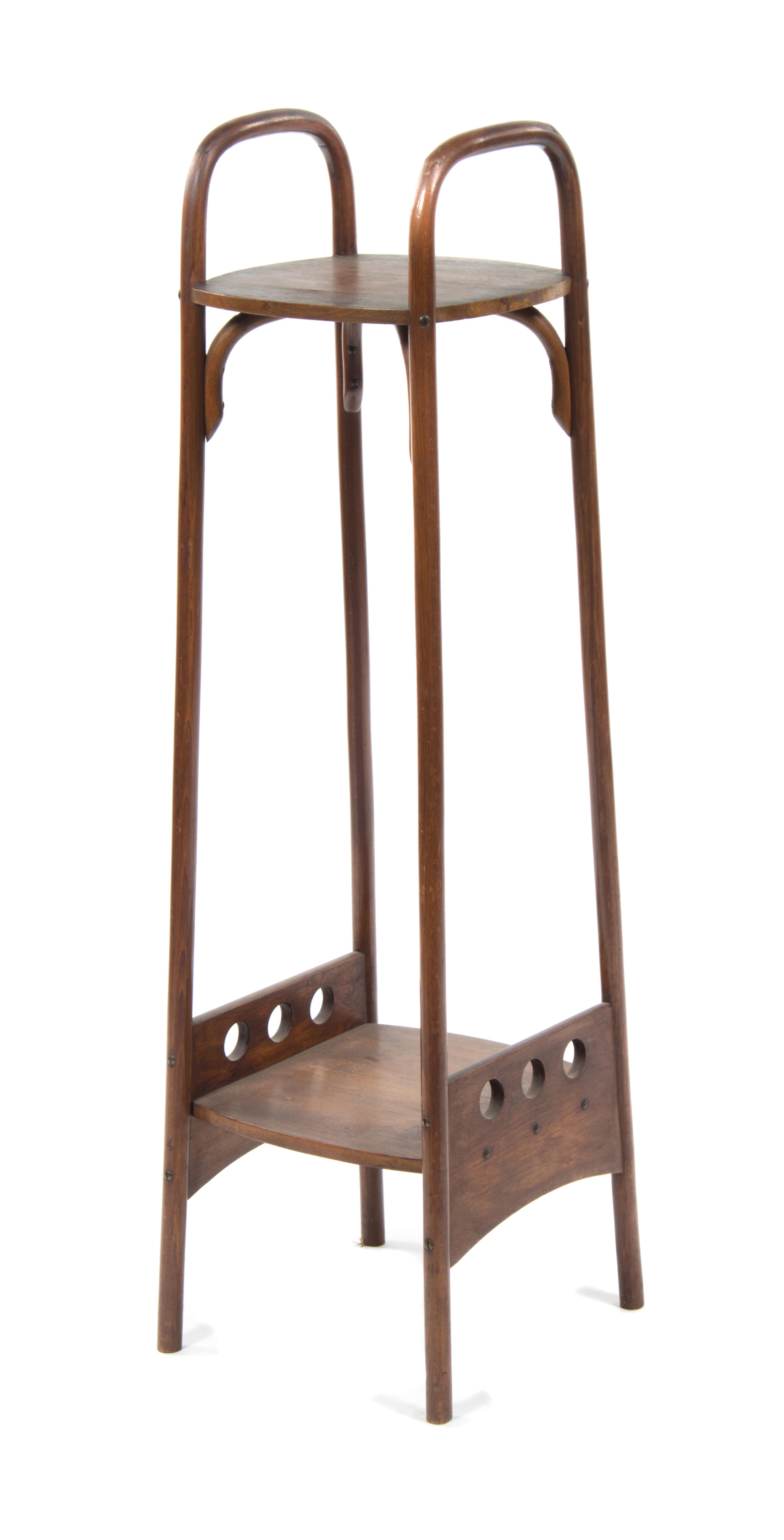 An Otto Prutscher Mahogany Etagere, for Thonet Height 48 1/8 x width 12 1/4 x depth 13 1/2 inches.