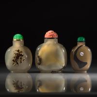 Three Chinese Carved "Shadow Agate" Snuff Bottles, 18th/19th Century and Later — 清中期及以後 瑪瑙巧雕鼻煙壺三支