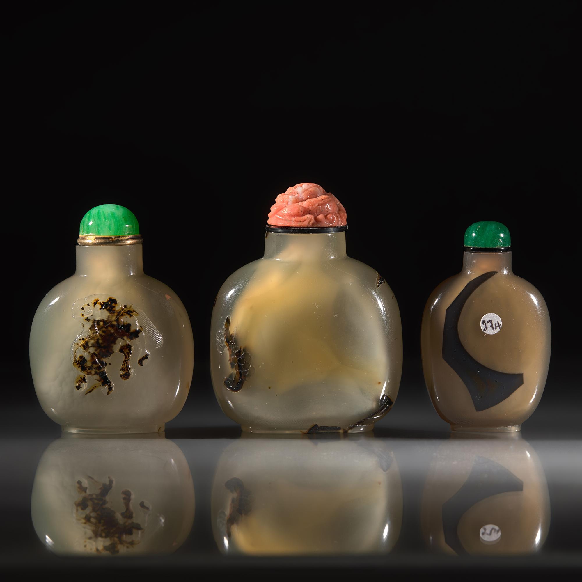Three Chinese Carved "Shadow Agate" Snuff Bottles, 18th/19th Century and Later — 清中期及以後 瑪瑙巧雕鼻煙壺三支