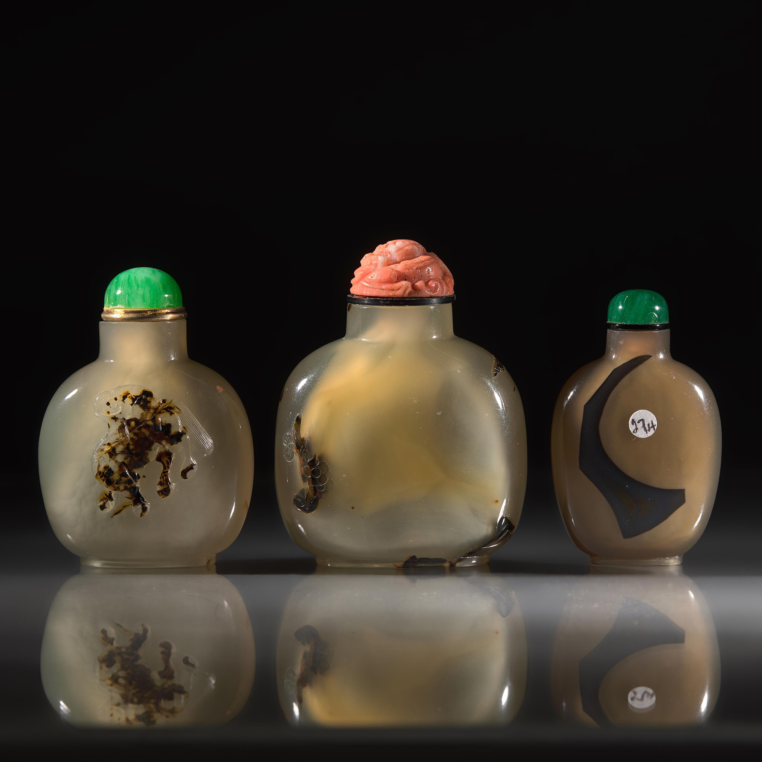 Three Chinese Carved "Shadow Agate" Snuff Bottles, 18th/19th Century and Later — 清中期及以後 瑪瑙巧雕鼻煙壺三支