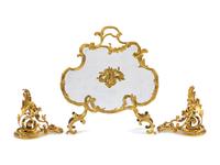 A Louis XV Style Gilt Metal Fire Screen and Associated Pair of Chenets