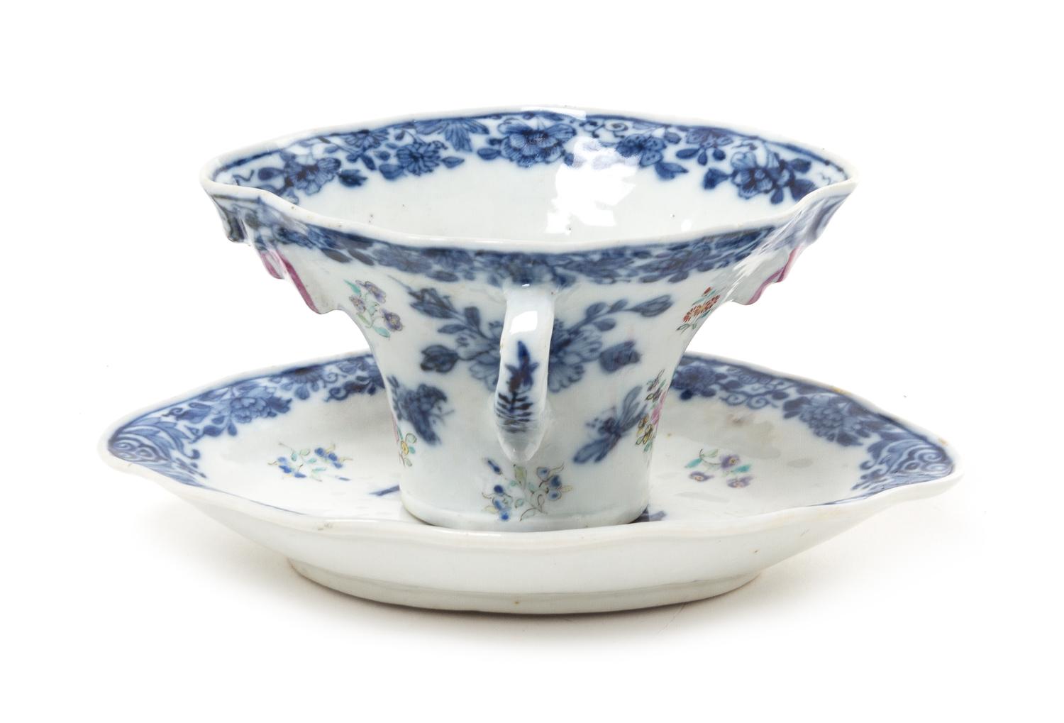 A Chinese Export Blue and White Porcelain Rhyton Cup and Underplate Width of saucer 6 3/4 inches.
