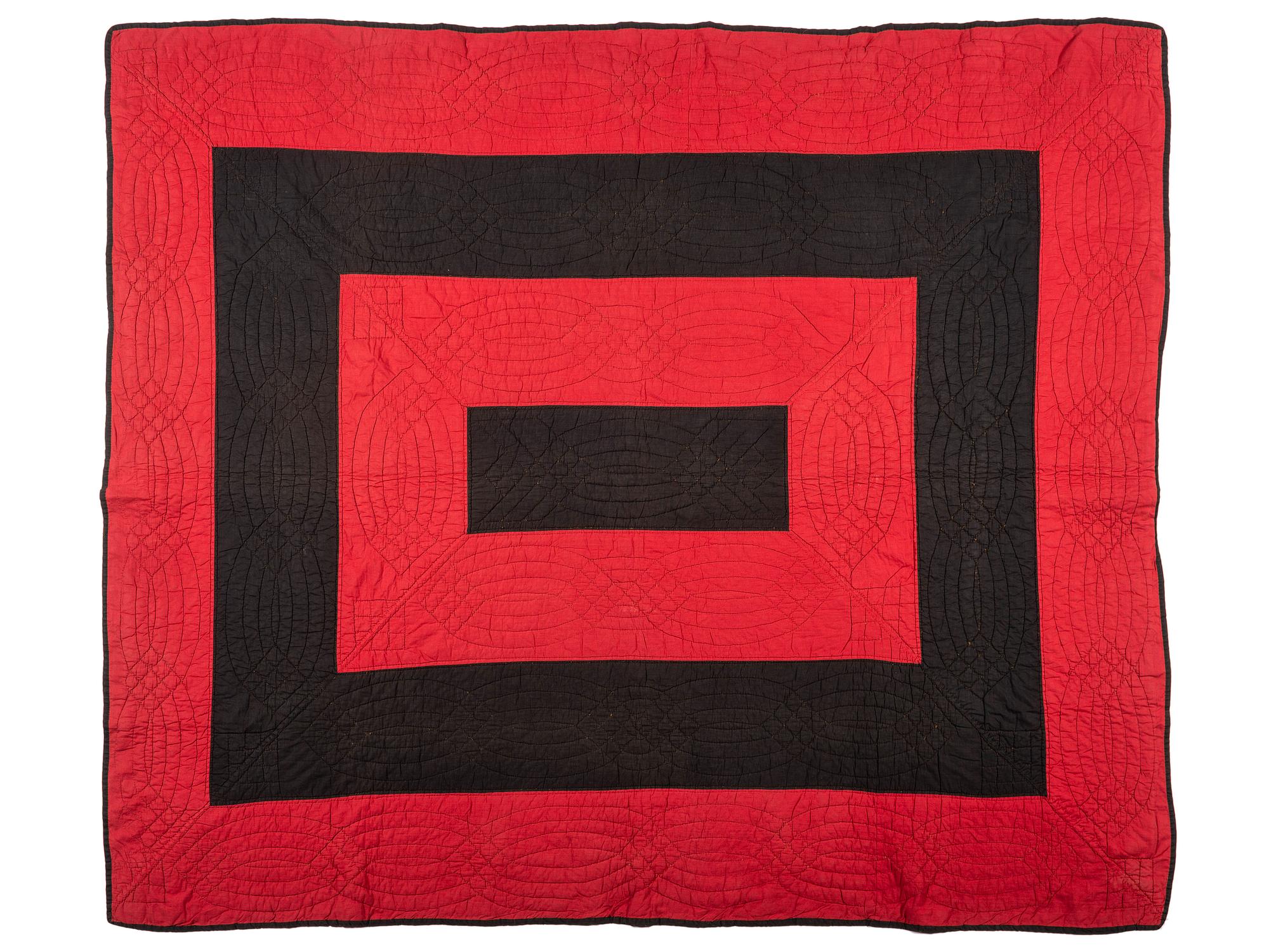 An Amish Red and Black Pieced Cotton Quilt