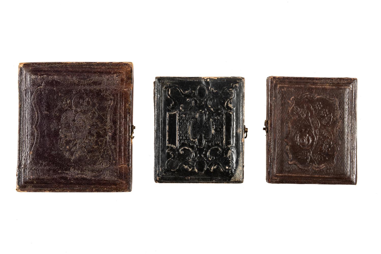 [EARLY PHOTOGRAPHY]. A group of daguerreotype portraits, incl. pendant, possible Hawaiian subject, and case featuring portrait of Daguerre.