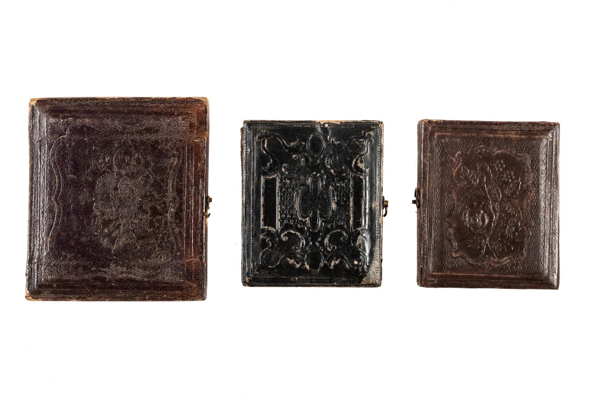 [EARLY PHOTOGRAPHY]. A group of daguerreotype portraits, incl. pendant, possible Hawaiian subject, and case featuring portrait of Daguerre.