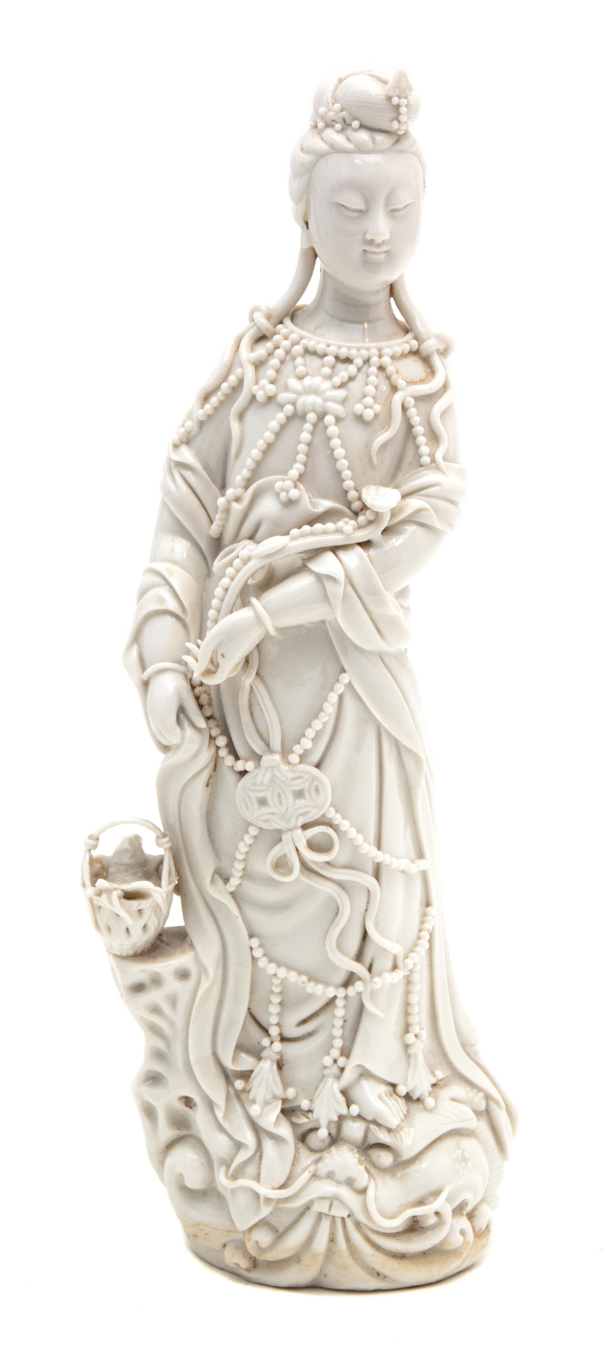 A Chinese Blanc de Chine Figure of Guanyin Height 10 1/2 inches. — 20TH CENTURY