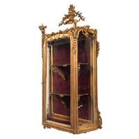 A Rococo Revival Carved Giltwood Hanging Collector's Cabinet