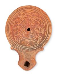 Ten Roman Terracotta Oil Lamps and a Holy Land Pottery Jug