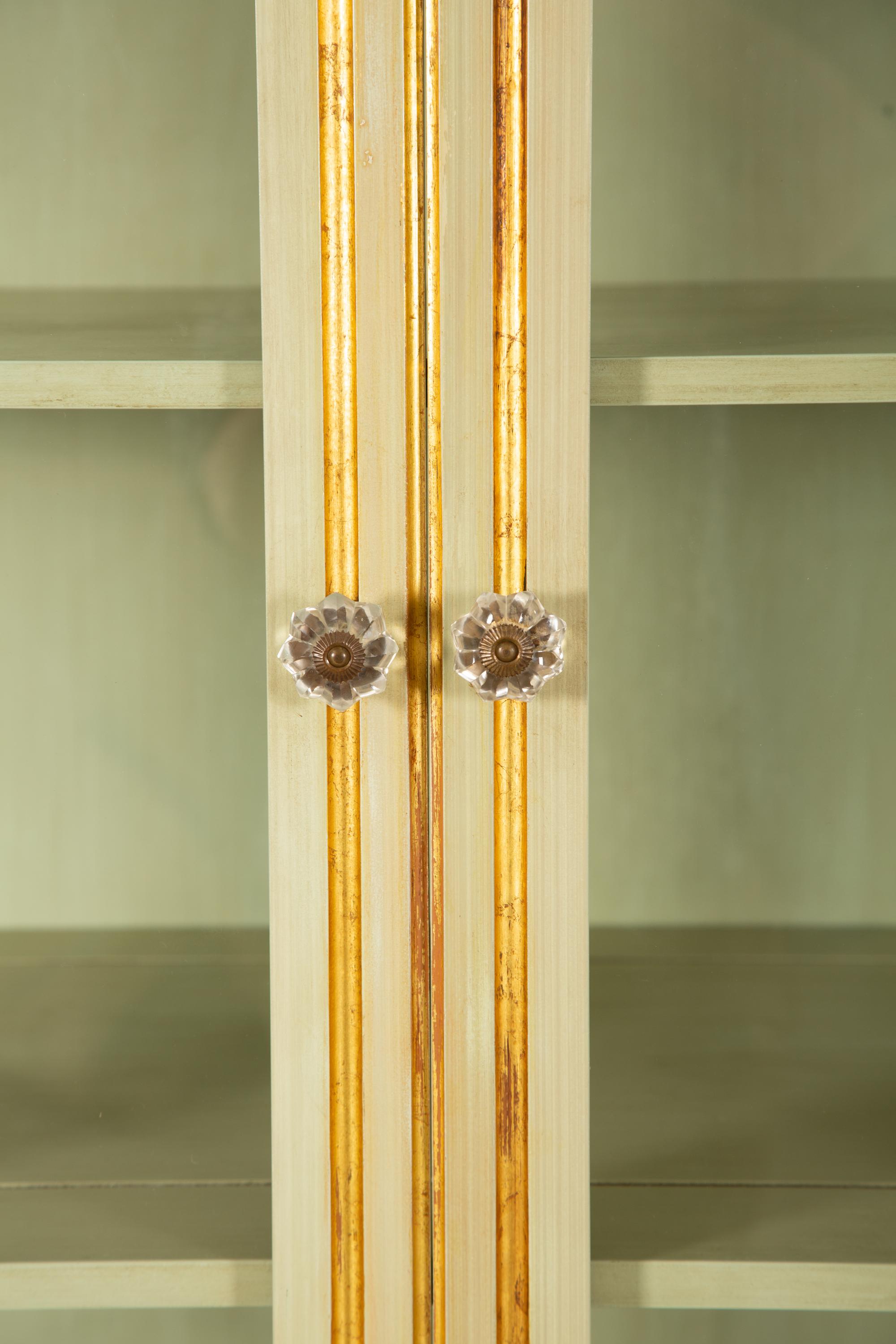An Empire Style Painted and Parcel Gilt Vitrine Cabinet