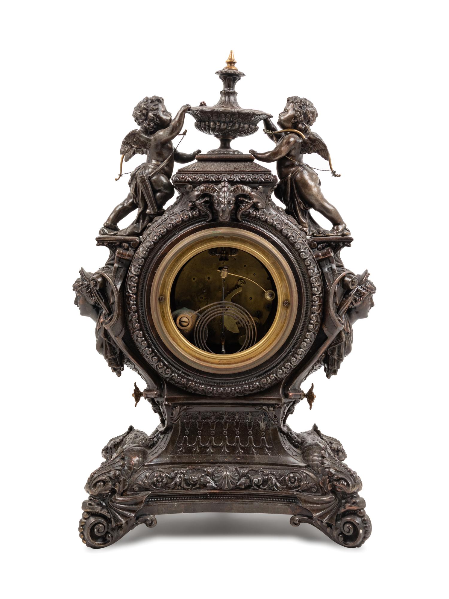An Ansonia Lydia Patinated Metal Figural Mantel Clock