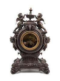 An Ansonia Lydia Patinated Metal Figural Mantel Clock