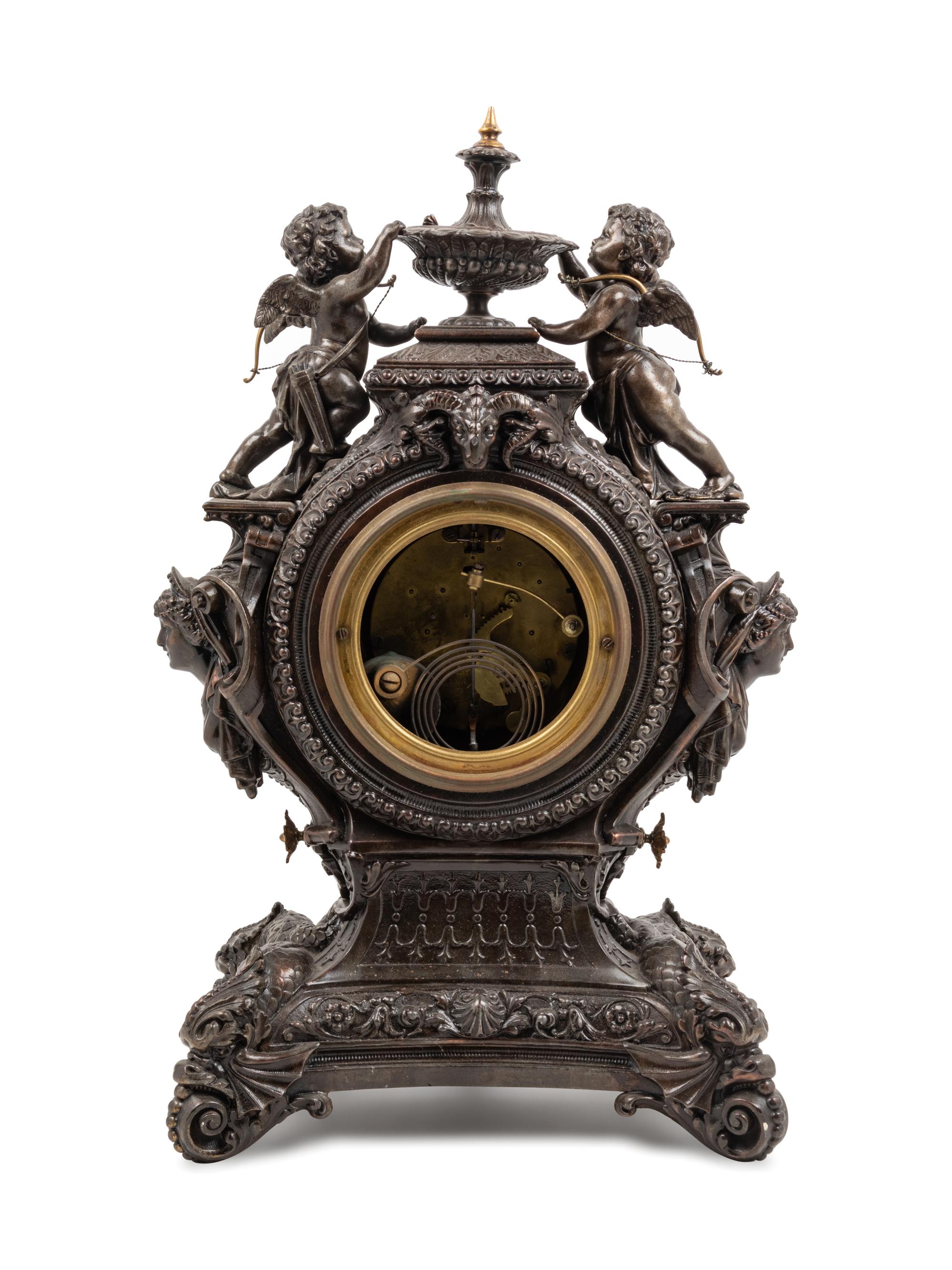 An Ansonia Lydia Patinated Metal Figural Mantel Clock