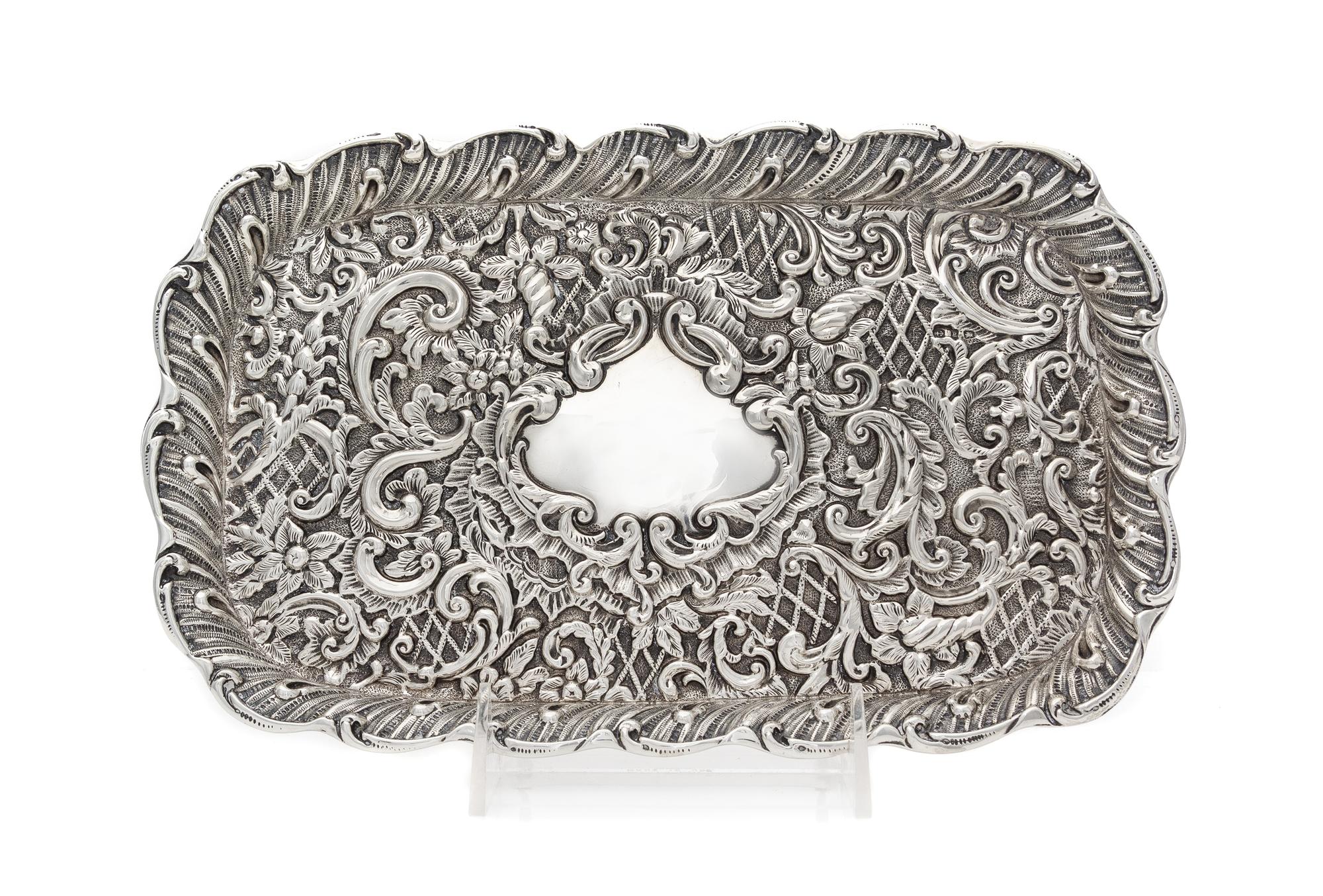 A Victorian Silver Tray, H. Matthews, Birmingham, 1898, of rectangular form with allover rococo decoration, centered by a vacant cartou