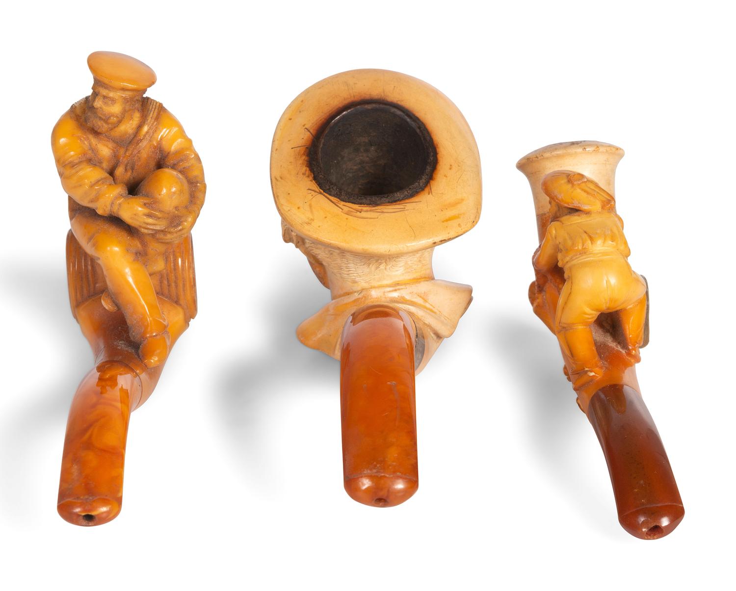 Three Carved Meerschaum Figural Pipes