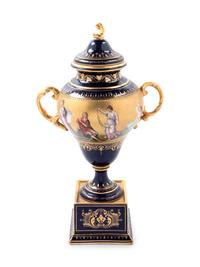 A Vienna Style Painted and Parcel Gilt Porcelain Covered Urn on Stand