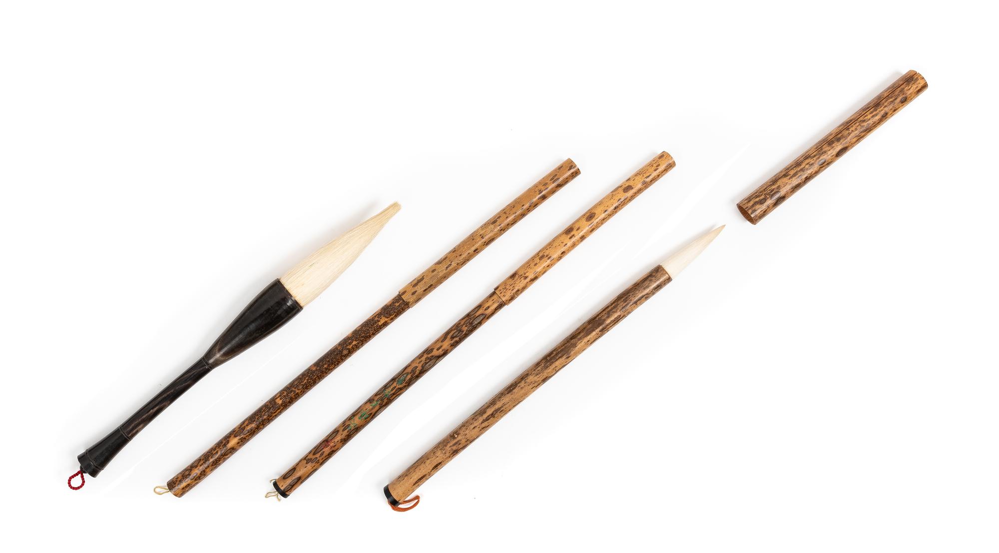 Four Chinese Hardwood and Bamboo Calligraphy Brushes Length of largest 13 inches. — QING DYNASTY (1644-1911)