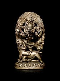 A Tibetan Gilt Bronze Figure of Mahakala and Consort