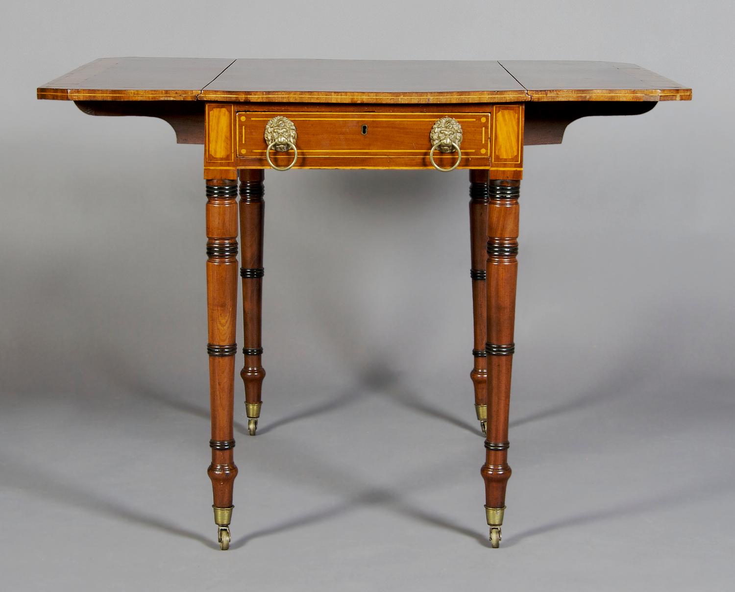 A English Regency Pembroke Table, Height 27 inches.