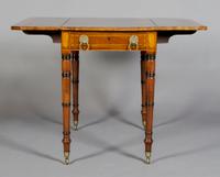 A English Regency Pembroke Table, Height 27 inches.