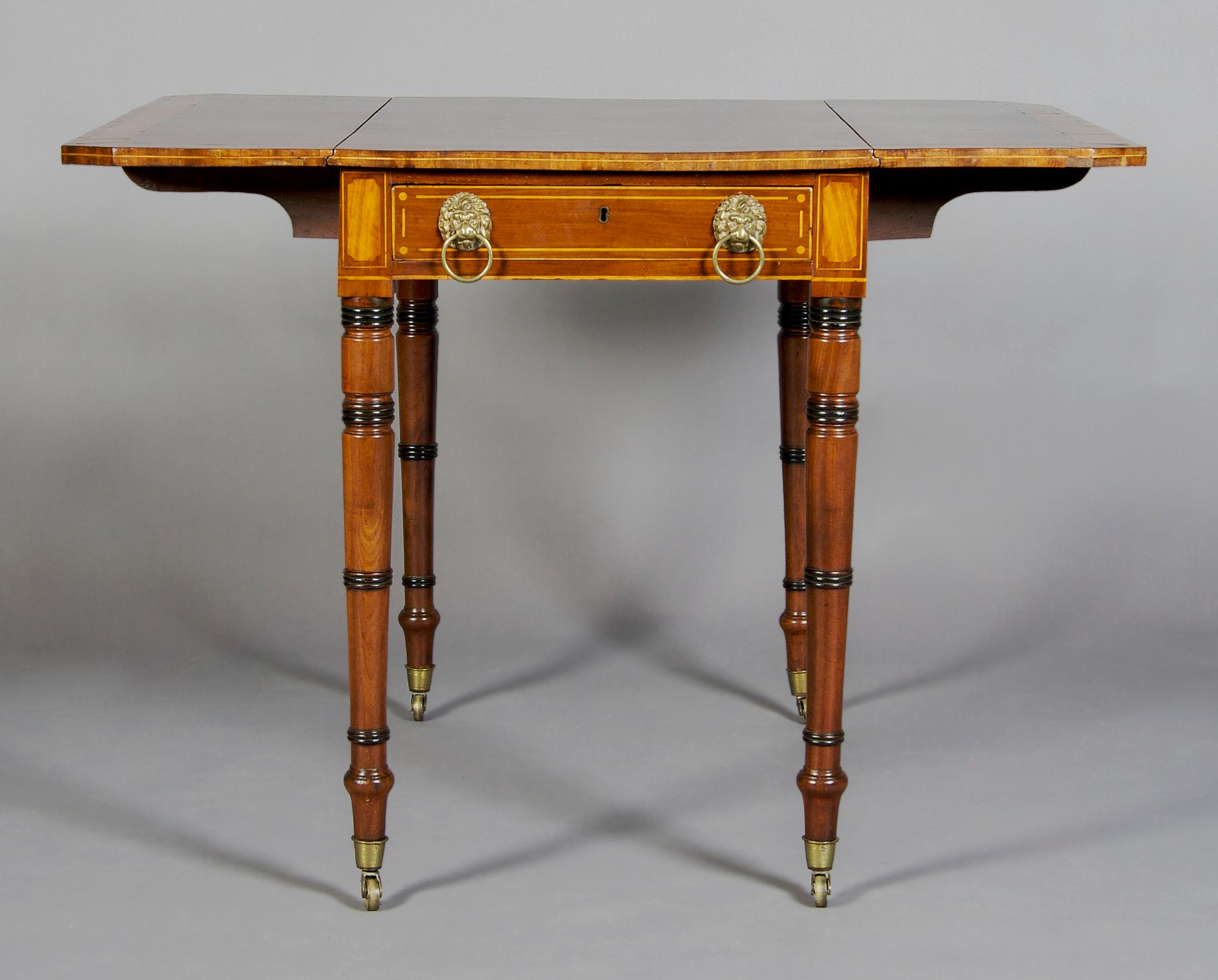 A English Regency Pembroke Table, Height 27 inches.