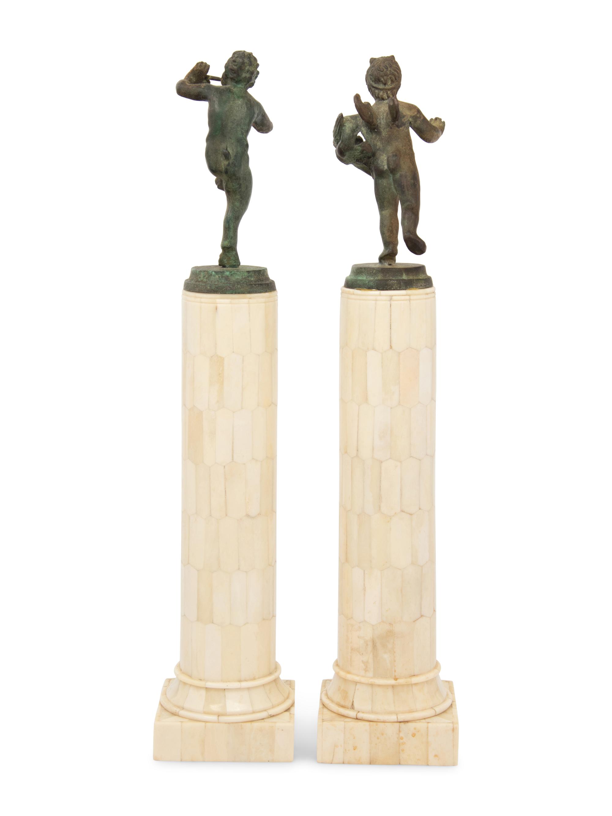 A Matched Pair of Bronze Figures on Resin Veneered Columns