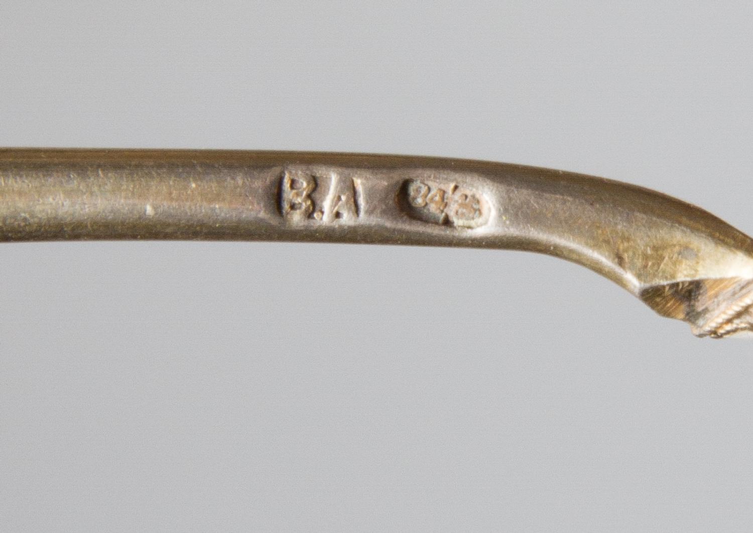 A Russian Silver-Gilt and Enamel Spoon, Mark of Vasiili Agafonov, Moscow, late 19th/early 20th century, having an enameled finial on a