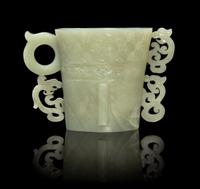A Chinese Celadon Jade Libation Cup 17TH/18TH CENTURY Height 3 7/8 inches. — 17TH/18TH CENTURY