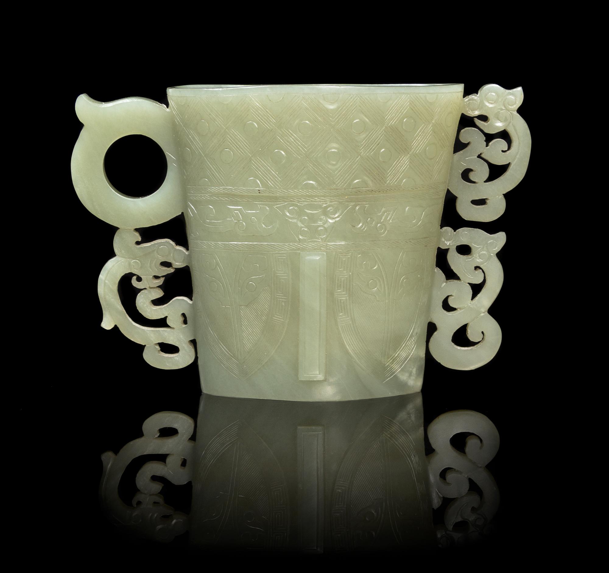 A Chinese Celadon Jade Libation Cup 17TH/18TH CENTURY Height 3 7/8 inches. — 17TH/18TH CENTURY