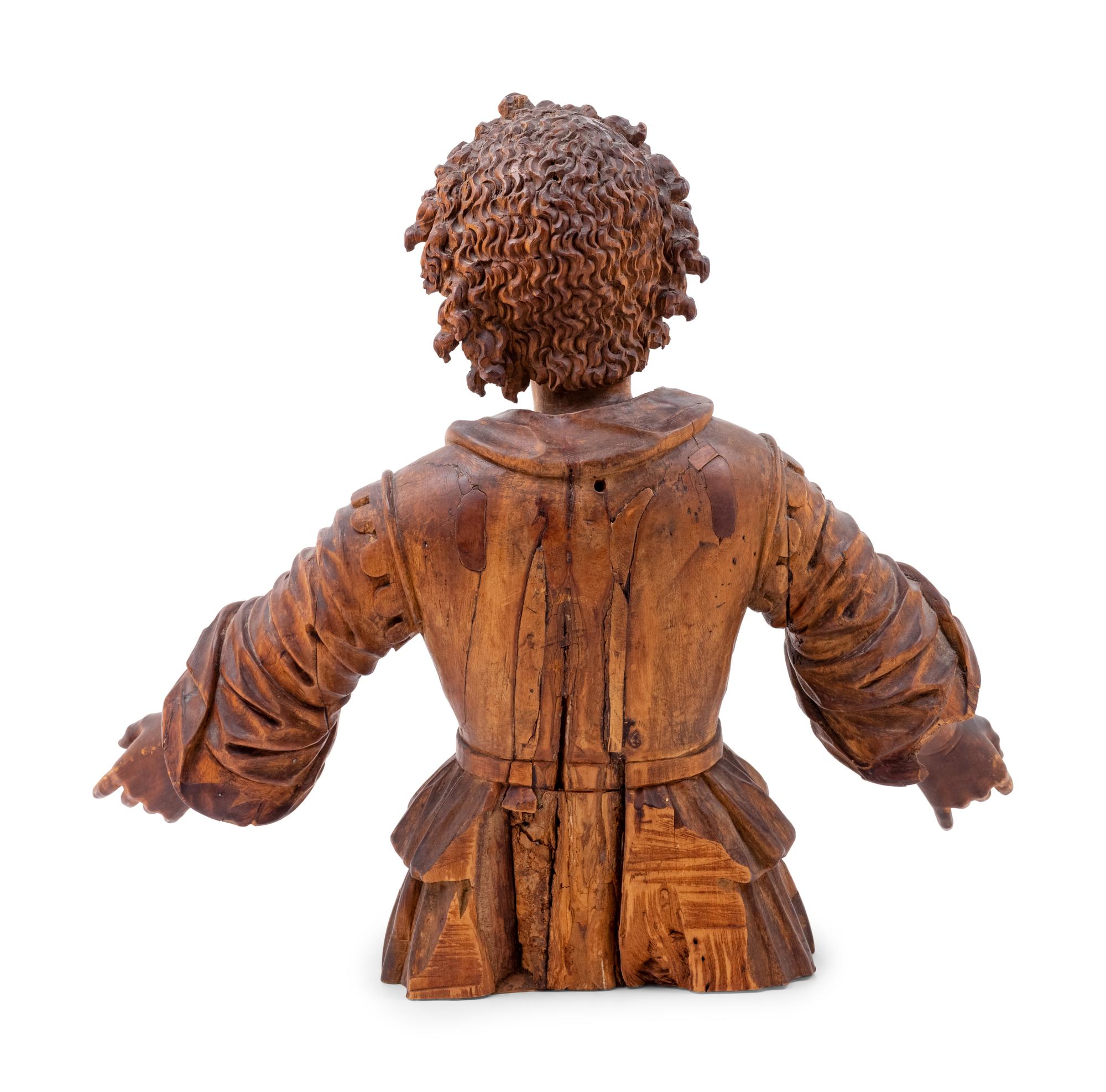 An Italian Carved Wood Figure of a Boy