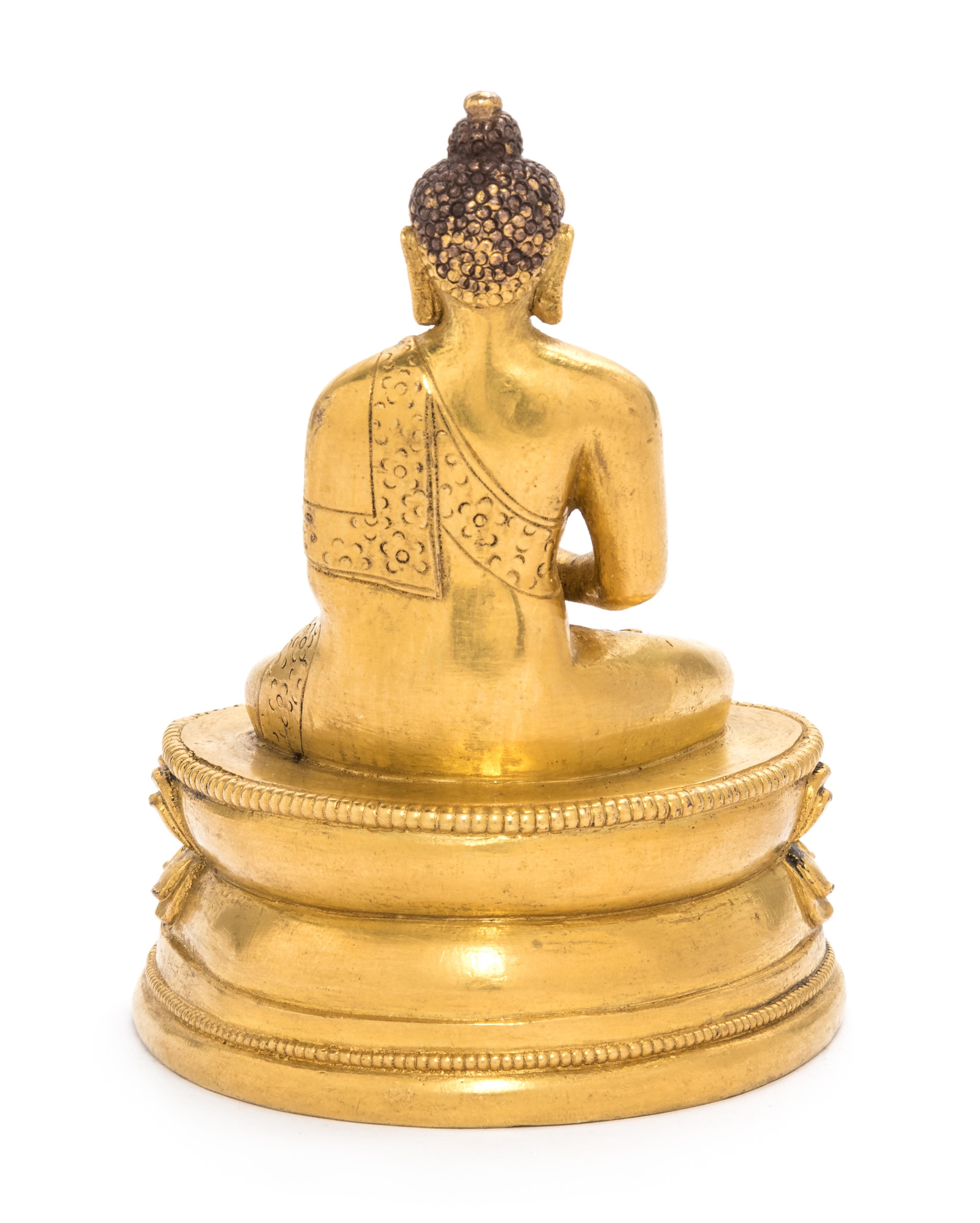 A Small Sino-Tibetan Gilt Bronze Figure of Shakyamuni Buddha Height 3 1/2 inches. — 18TH/19TH CENTURY