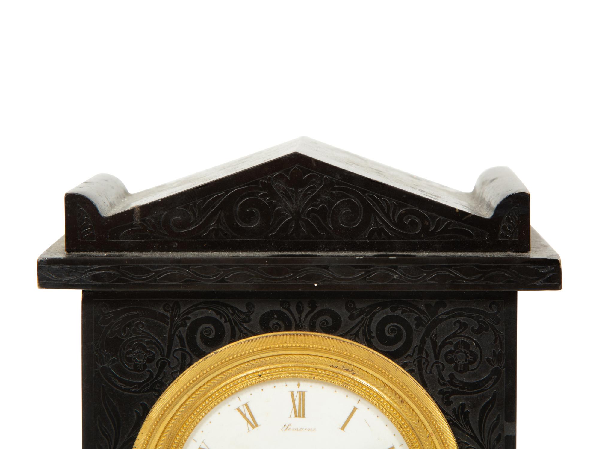 A Regency Black Slate and Gilt Bronze Mantel Clock