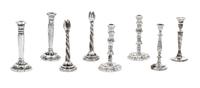 Four Pairs of Silver Candelabra, Various Makers, comprising a pair with tulip-form cups and a twisted stem; a pair having baluster form