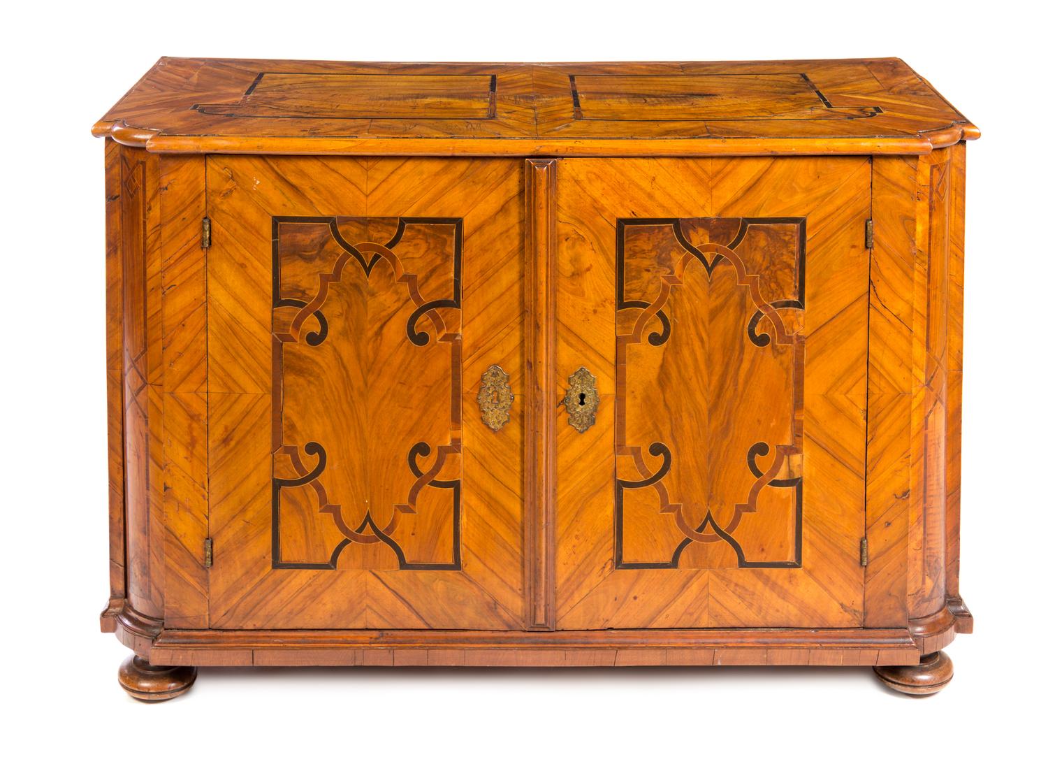 A German Banded Walnut Cabinet Height 32 1/2 x width 48 1/2 x depth 23 3/4 inches. — 19TH CENTURY