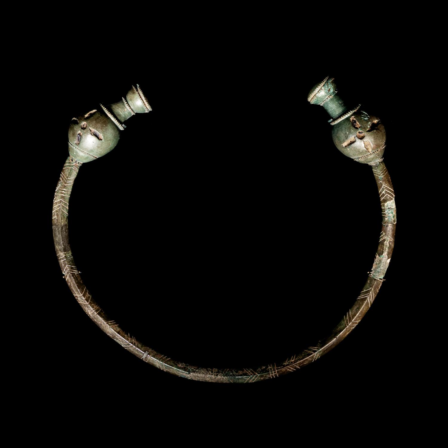 A Celtic Bronze Torc with Poppy-Head Terminals