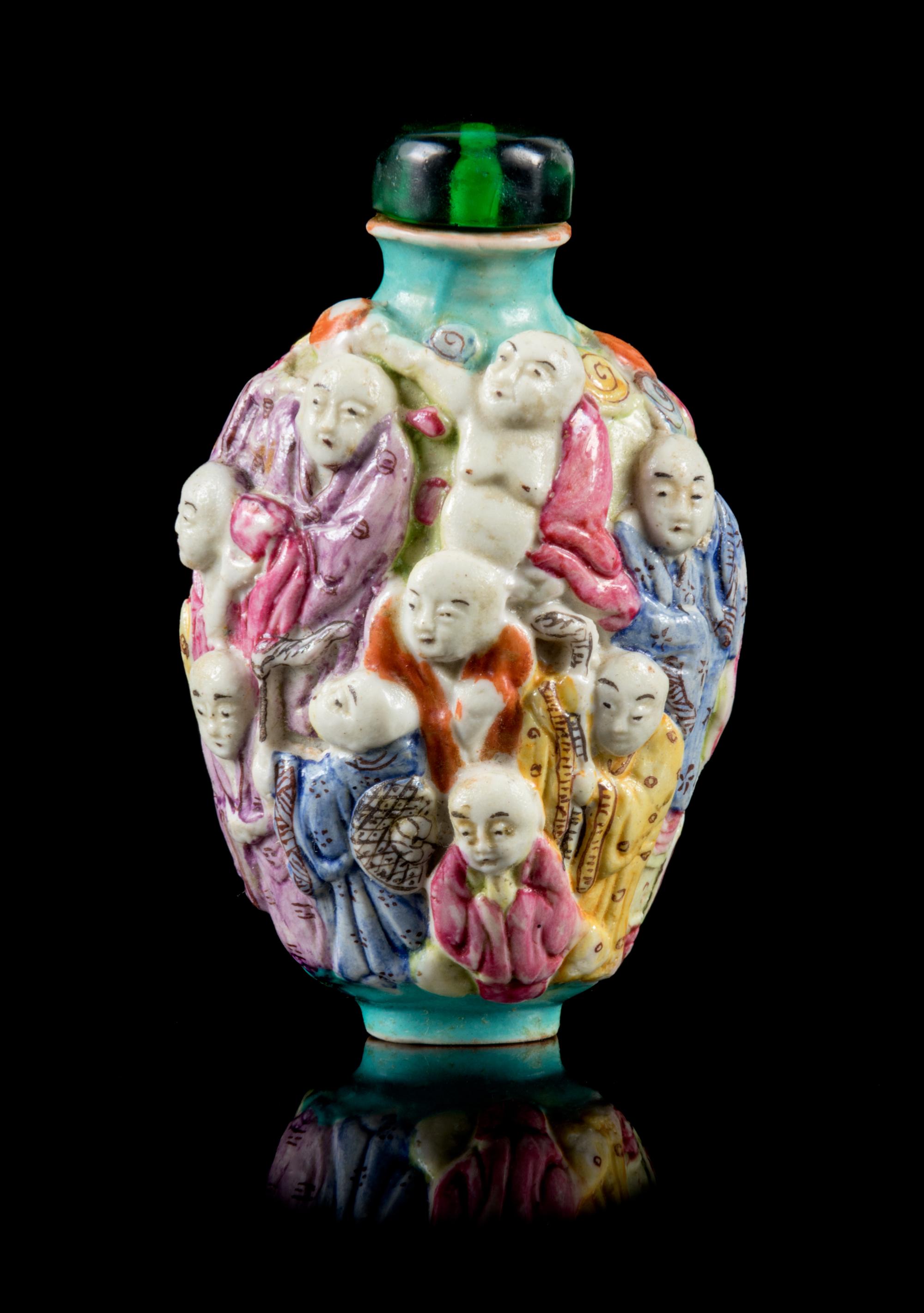 A Molded Famille Rose Porcelain Snuff Bottle Height 3 1/8 inches. — 19TH CENTURY